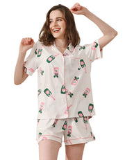 Champagne bottle print women’s knit cotton pajama set with short sleeve top and shorts on white background