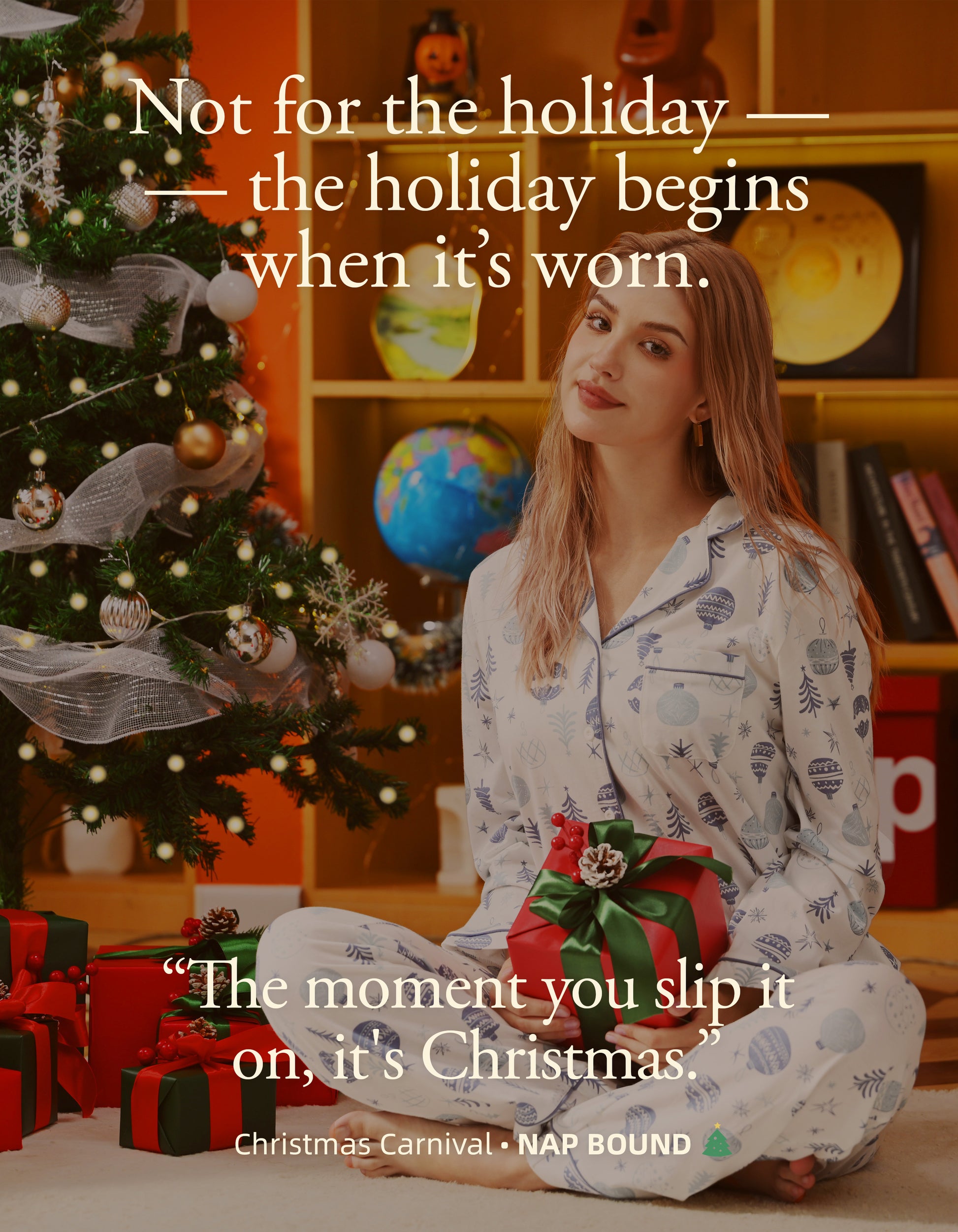 Woman wearing blue Christmas ornament cotton pajamas sitting by Christmas tree with gifts