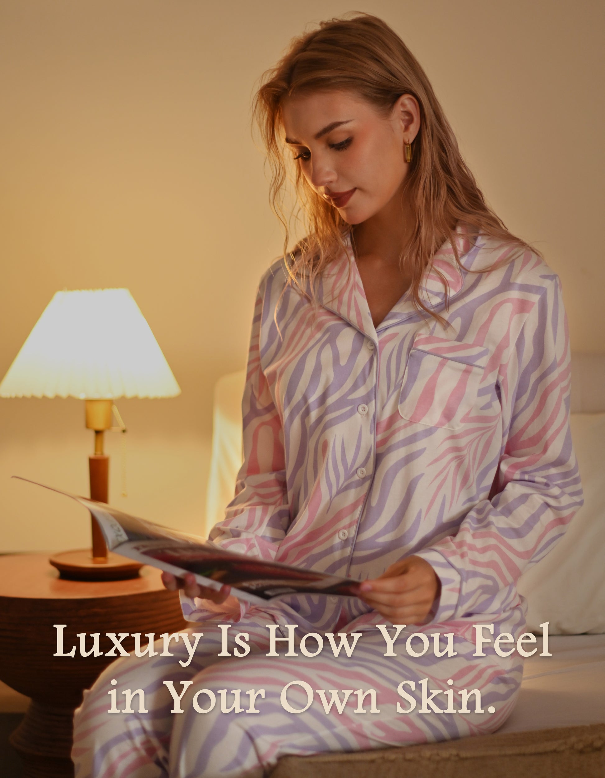 Woman wearing colorful zebra print cotton pajamas relaxing and reading at night