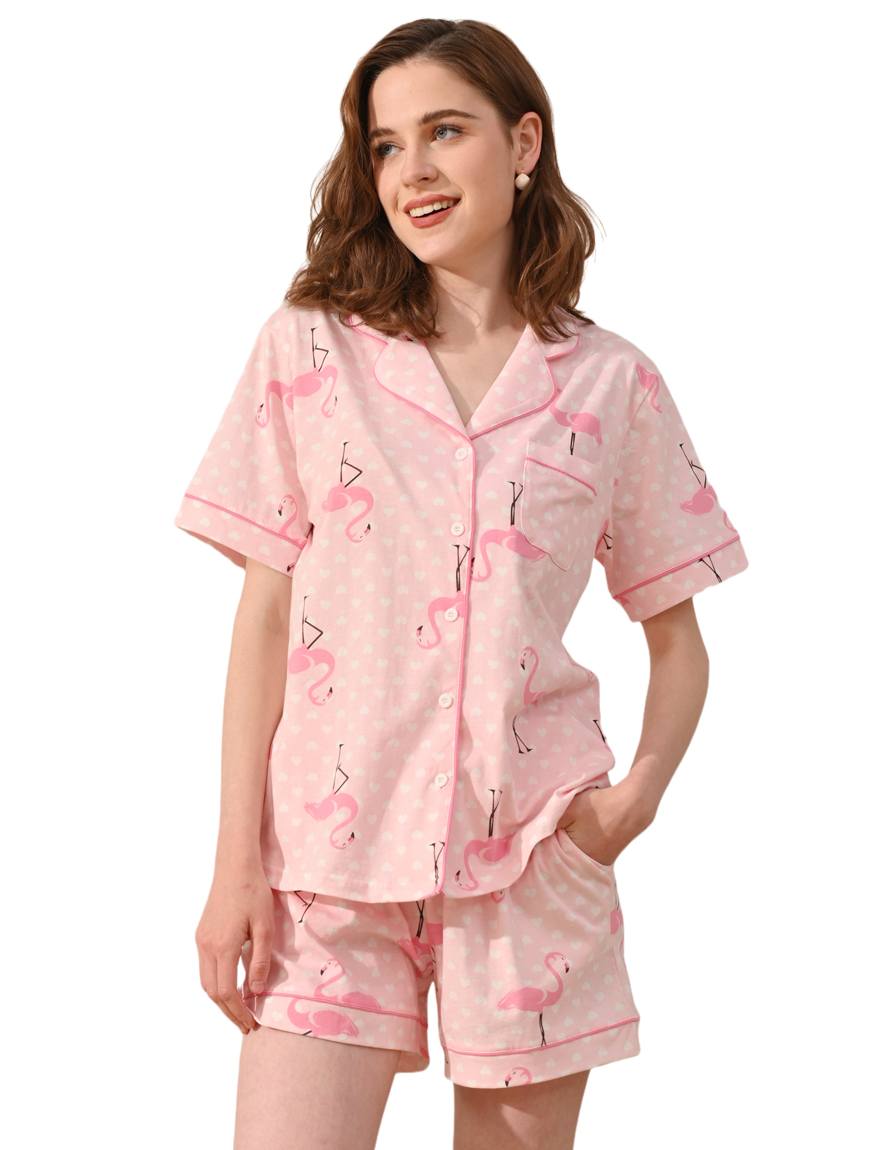 Pink flamingo print women’s knit cotton pajama set with short sleeve top and shorts on white background