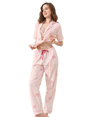 Pink stripe cotton pajama set with champagne glass and bow print front view on white background