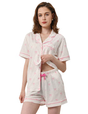 Polka dot bow print women’s knit cotton pajama set with short sleeve top and shorts on white background