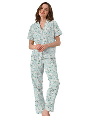 Women’s gardenia floral cotton pajama set with short sleeve button-down top and long pants on white background